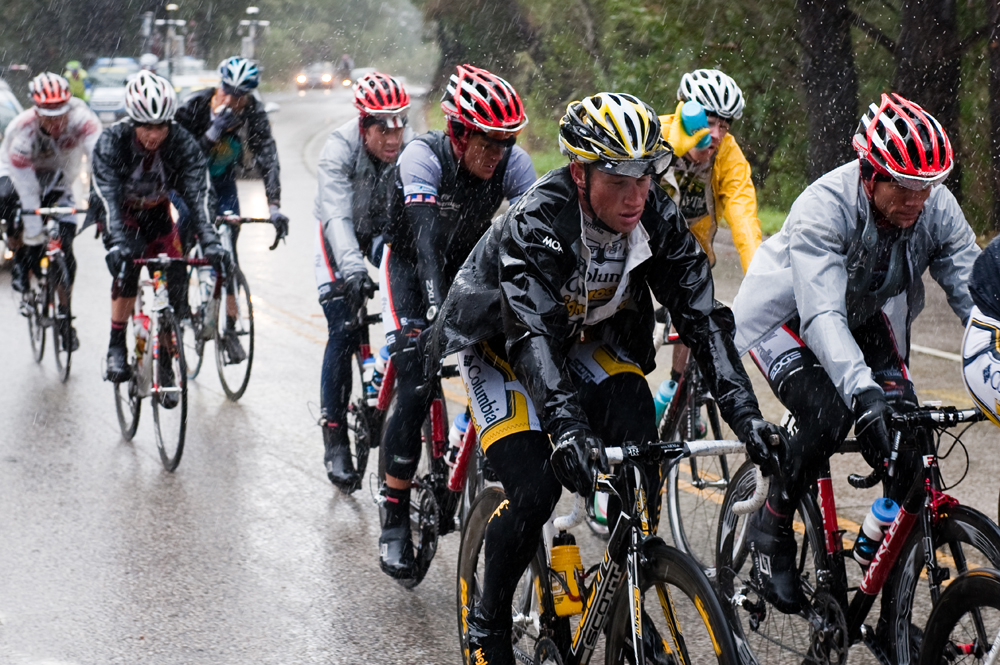 A group of cyclists in the rain
